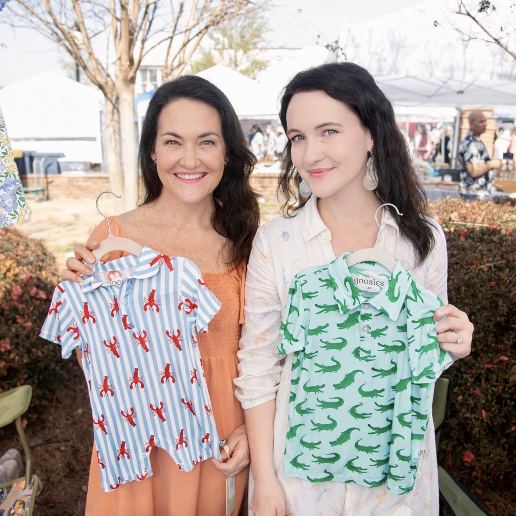 The mother-daughter team behind The Smocked Sparrow at an outdoor market on the Florida panhandle